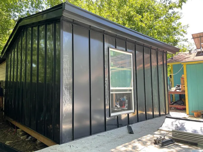 Black standing seam metal wall panels for Roof Inspection in El Rio