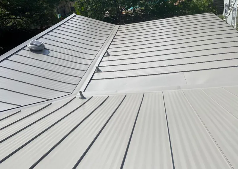 Solar attic fan installed on a metal roof for Roof Ventilation in El Rio